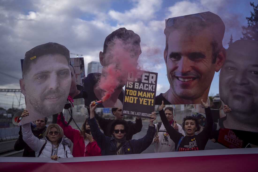 Relatives and supporters of Israelis held hostage in the Gaza Strip, hold photos depicting their faces during a protest demanding their release from Hamas captivity, in Tel Aviv, Israel on Thursday.